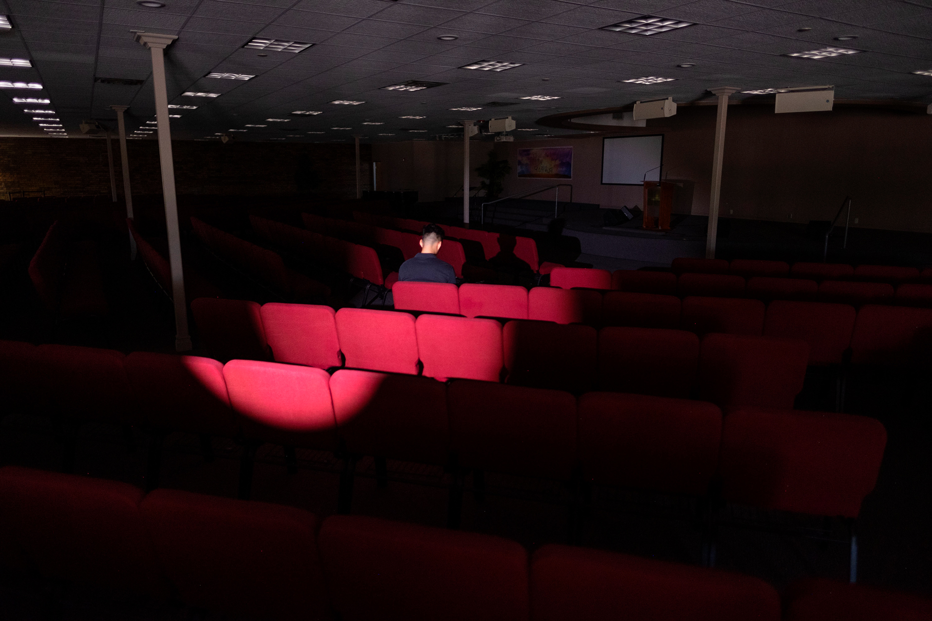 a person sitting in a row of seats